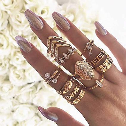 Juego de anillos de oro con forma de nudillos tallados para los