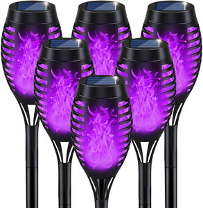 Luces solares de Halloween moradas con llama parpadeante