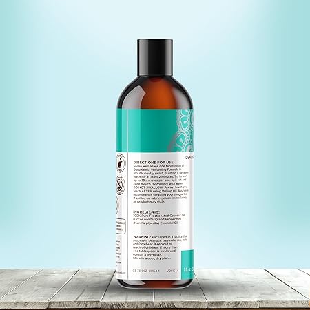 GuruNanda Aceite blanqueador para jalar con aceite de coco y aceite de menta para blanquear los dientes naturales A24