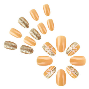 Uñas postizas a presión de Navidad, uñas postizas cortas de almendra, uñas postizas con purpurina dorada con diseño de lazo, uñas acrílicas brillantes A22 , cobertura completa, uñas adhesivas naranjas